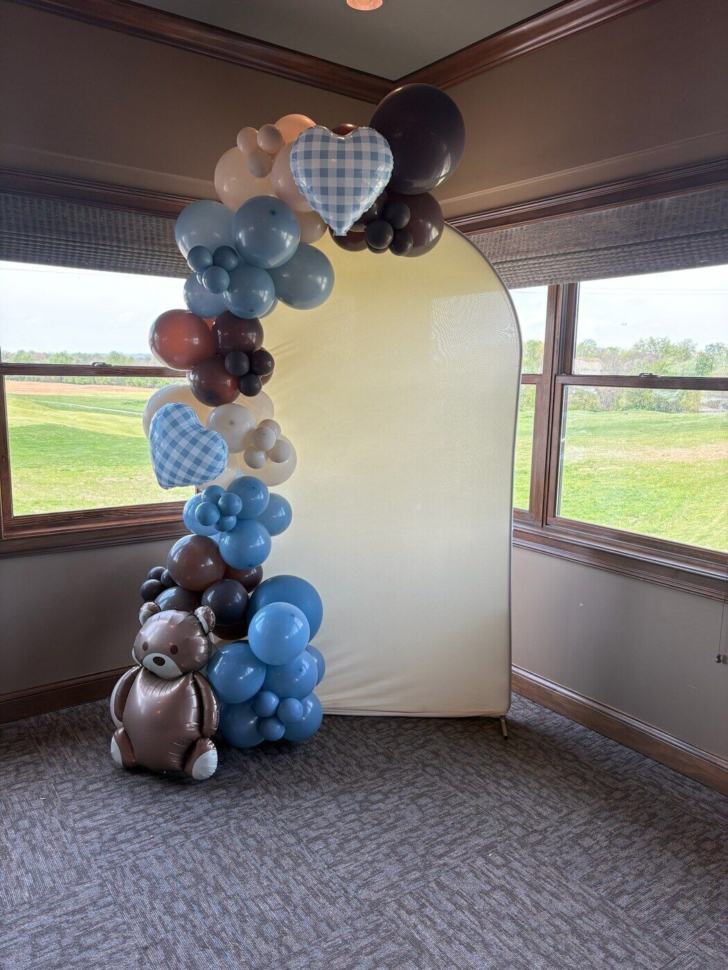 Teddy bear baby shower balloon arch in blue and cream