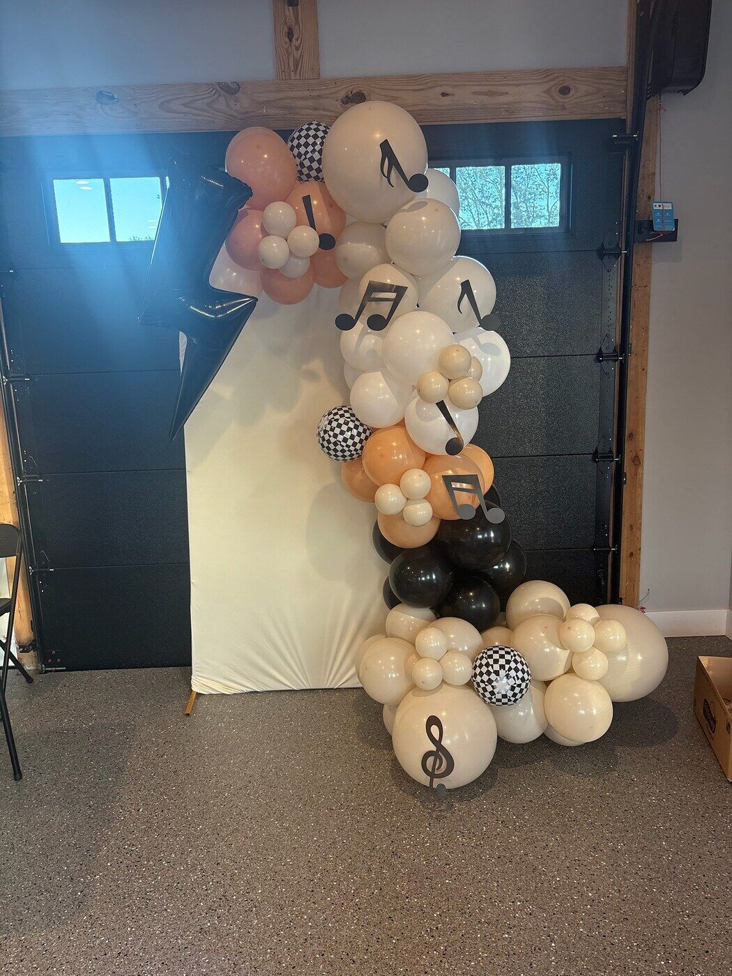 Black, white and cream balloon garland with music note balloons