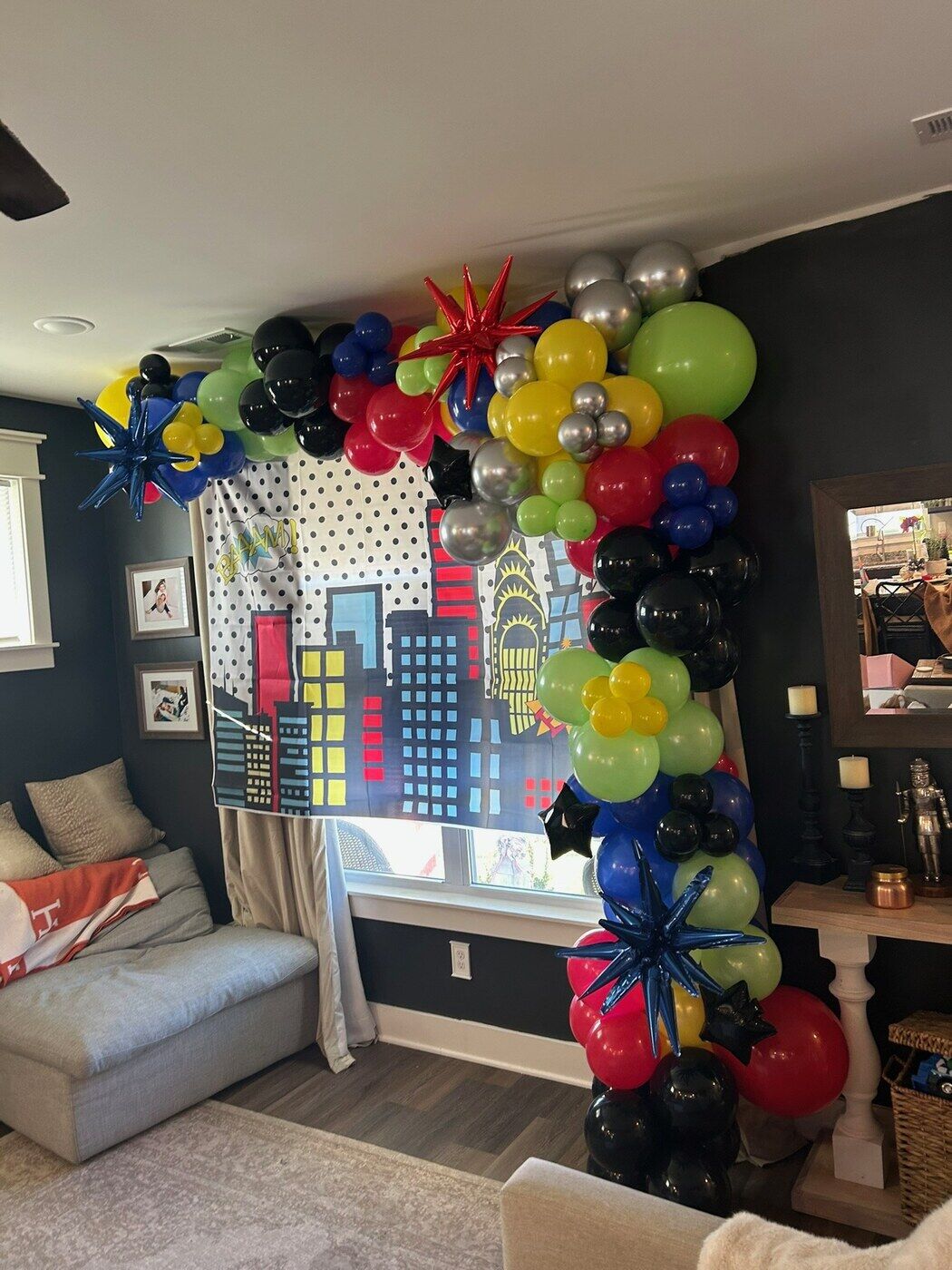 Superhero city themed balloon backdrop in primary colors